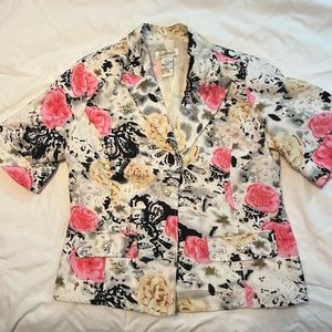 Short sleeve, pink and black floral print waist length jacket.